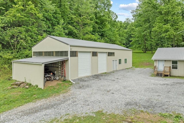 938 Riley Creek Rd, Whitleyville, TN 38588 - garage with a detached garage and a forest view