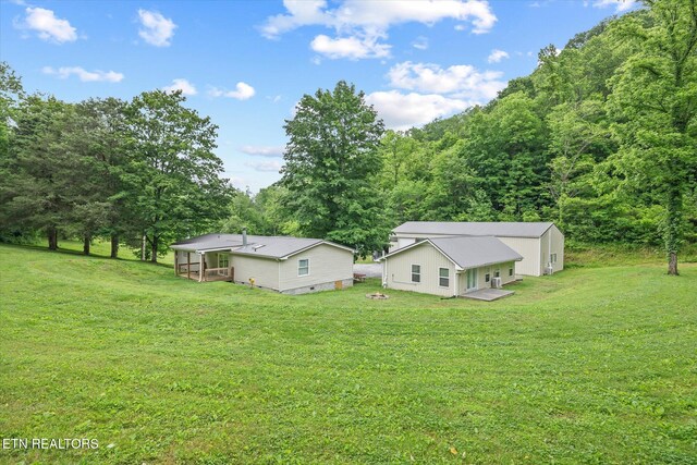 938 Riley Creek Rd, Whitleyville, TN 38588 - view of green lawn with a wooded view