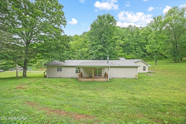938 Riley Creek Rd, Whitleyville, TN 38588 - rear view of house with crawl space, a yard, and metal roof