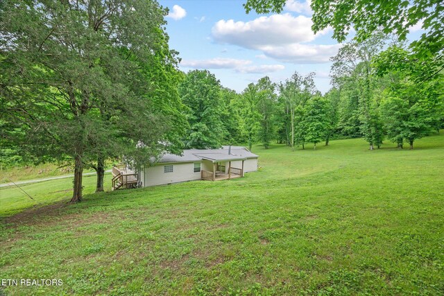 938 Riley Creek Rd, Whitleyville, TN 38588 - view of grassy yard with a wooden deck