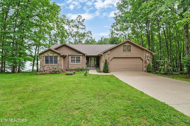 45 Calderwood Cir, Fairfield Glade, TN 38558 - view of front of home featuring stone siding, a garage, a chimney, concrete driveway, and a front yard
