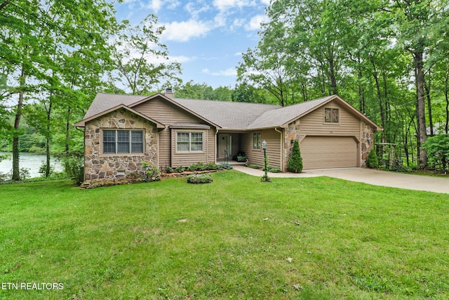 45 Calderwood Cir, Fairfield Glade, TN 38558 - ranch-style home with concrete driveway, stone siding, a garage, a front lawn, and a shingled roof