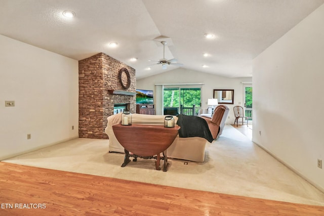 45 Calderwood Cir, Fairfield Glade, TN 38558 - carpeted living room with ceiling fan, vaulted ceiling, a fireplace, and wood finished floors