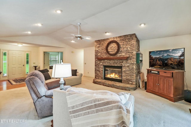 45 Calderwood Cir, Fairfield Glade, TN 38558 - living area featuring lofted ceiling, a stone fireplace, ceiling fan, and light colored carpet
