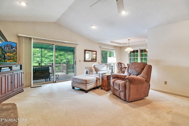 45 Calderwood Cir, Fairfield Glade, TN 38558 - carpeted living room featuring a ceiling fan, lofted ceiling, a textured ceiling, and baseboards