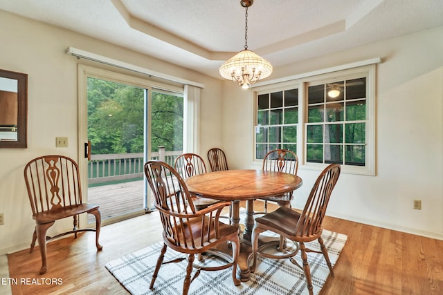45 Calderwood Cir, Fairfield Glade, TN 38558 - dining space featuring a chandelier, a raised ceiling, wood finished floors, and baseboards