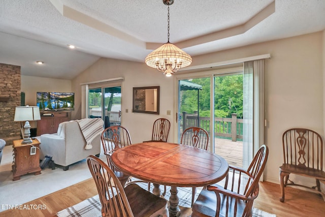 45 Calderwood Cir, Fairfield Glade, TN 38558 - dining space with a chandelier, a textured ceiling, wood finished floors, a raised ceiling, and baseboards