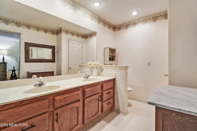 45 Calderwood Cir, Fairfield Glade, TN 38558 - full bath featuring double vanity, toilet, baseboards, and recessed lighting