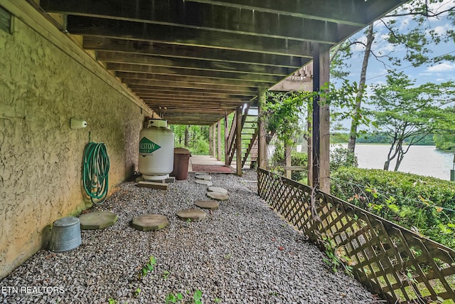 45 Calderwood Cir, Fairfield Glade, TN 38558 - view of patio featuring stairs and a water view