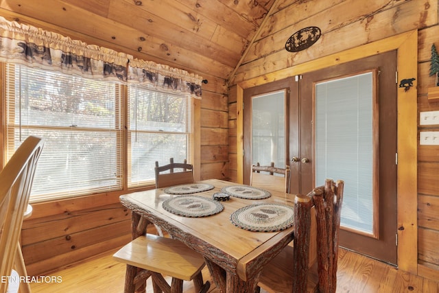 214 Tsali Way, Sevierville, TN 37876 - dining space with light wood-type flooring, vaulted ceiling, wood walls, and wooden ceiling