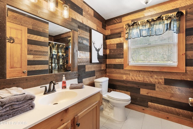 214 Tsali Way, Sevierville, TN 37876 - full bathroom with wooden walls, vanity, toilet, tile patterned flooring, and curtained shower