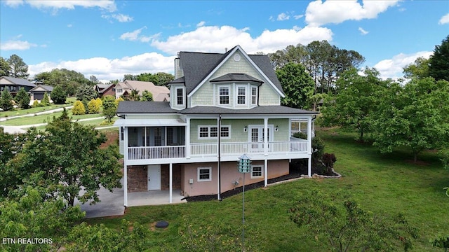 309 Southshore Dr, Greenback, TN 37742 - back of house featuring a patio area, a sunroom, and a yard