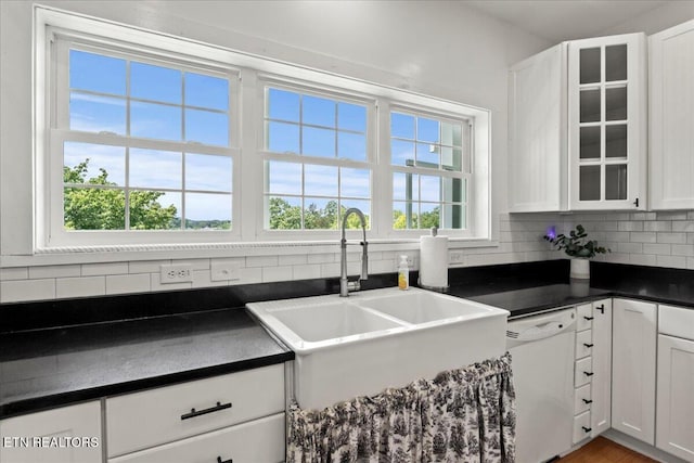 309 Southshore Dr, Greenback, TN 37742 - kitchen featuring dishwasher, a sink, dark countertops, decorative backsplash, and white cabinets