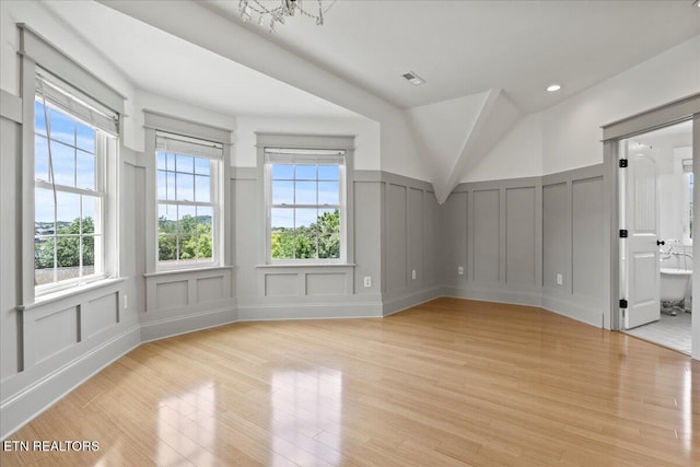 309 Southshore Dr, Greenback, TN 37742 - bonus room featuring a decorative wall, light wood-type flooring, and wainscoting