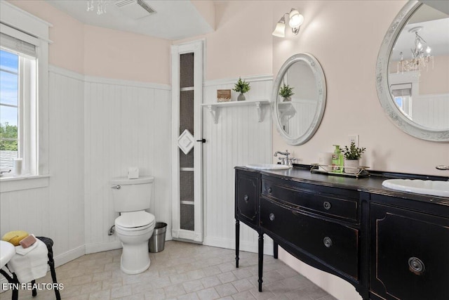 309 Southshore Dr, Greenback, TN 37742 - bathroom featuring double vanity, toilet, baseboards, and tile patterned floors