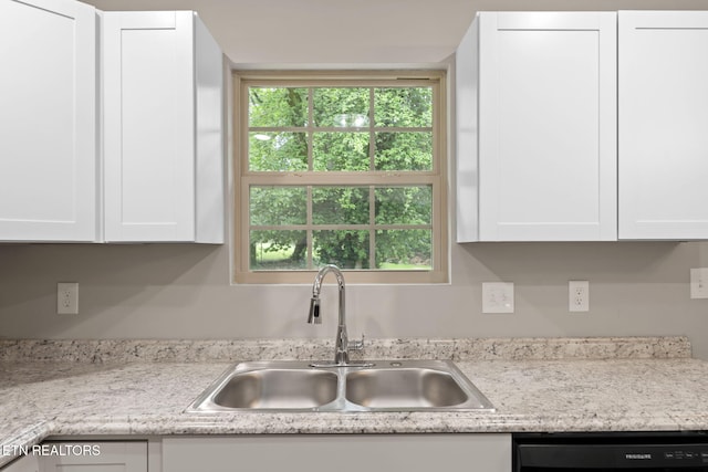 109 Ivy Ln, Oak Ridge, TN 37830 - kitchen with black dishwasher, light countertops, and white cabinets