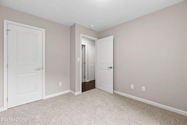 109 Ivy Ln, Oak Ridge, TN 37830 - unfurnished bedroom featuring carpet and baseboards