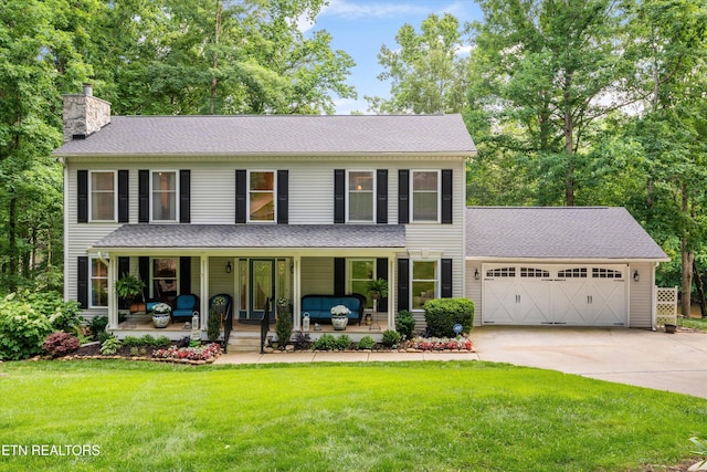 109 Cheeskogili Way, Loudon, TN 37774 - colonial home with a porch, a chimney, a garage, driveway, and a front lawn