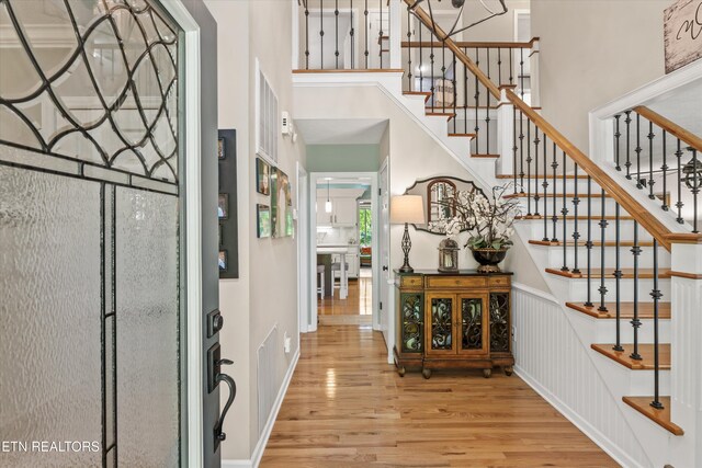 109 Cheeskogili Way, Loudon, TN 37774 - entryway featuring wood finished floors, a towering ceiling, and stairway