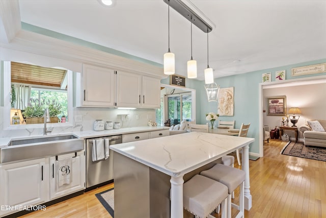 109 Cheeskogili Way, Loudon, TN 37774 - kitchen with dishwasher, a sink, white cabinets, and decorative light fixtures