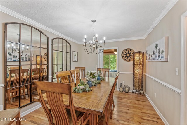 109 Cheeskogili Way, Loudon, TN 37774 - dining space featuring a chandelier, light wood-style flooring, ornamental molding, and baseboards