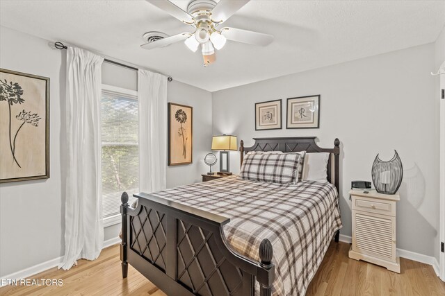 109 Cheeskogili Way, Loudon, TN 37774 - bedroom with light wood-type flooring, baseboards, and a ceiling fan