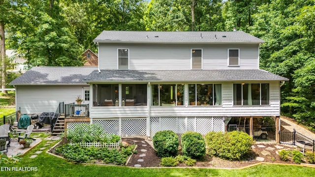 109 Cheeskogili Way, Loudon, TN 37774 - rear view of house with a sunroom, stairway, a shingled roof, a wooden deck, and a patio area