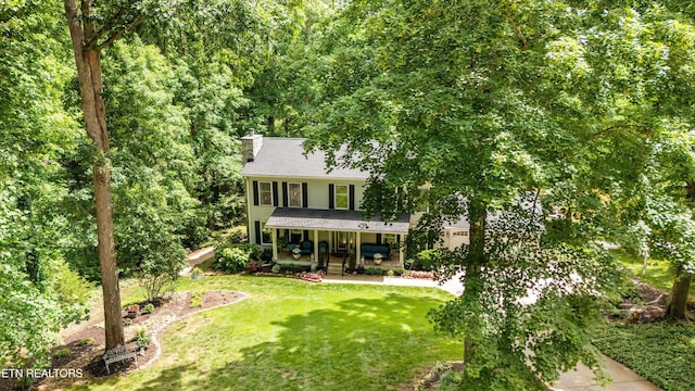 109 Cheeskogili Way, Loudon, TN 37774 - colonial home featuring a porch, a chimney, a front yard, and a shingled roof