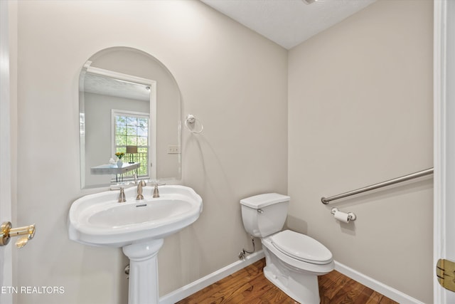 11514 Dobe Way, Knoxville, TN 37932 - half bath featuring wood finished floors, toilet, and baseboards