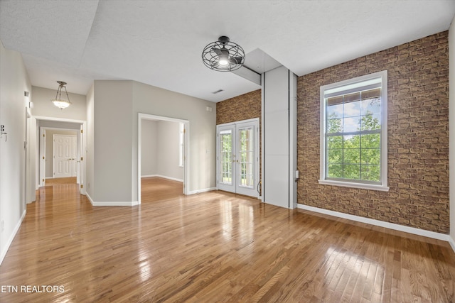 11514 Dobe Way, Knoxville, TN 37932 - unfurnished living room with baseboards, light wood-type flooring, and french doors