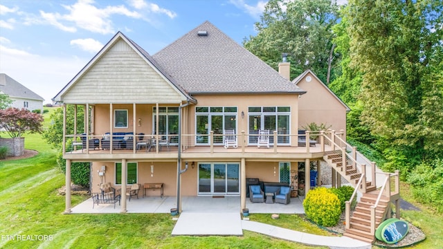 325 Pineberry Dr, Vonore, TN 37885 - rear view of house featuring stucco siding, stairs, a yard, and a patio area