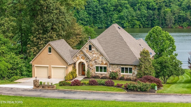325 Pineberry Dr, Vonore, TN 37885 - view of front of property featuring stone siding, concrete driveway, a garage, and a front lawn