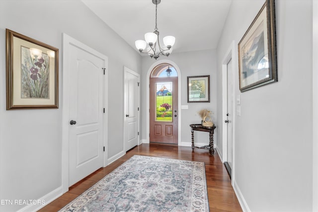 325 Pineberry Dr, Vonore, TN 37885 - entryway with a chandelier, dark wood-type flooring, and baseboards