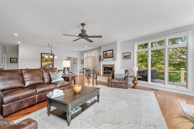325 Pineberry Dr, Vonore, TN 37885 - living room with wood finished floors, a ceiling fan, recessed lighting, a glass covered fireplace, and baseboards