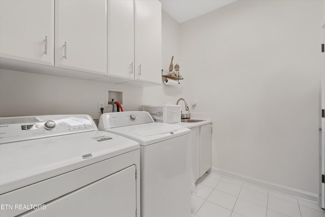 325 Pineberry Dr, Vonore, TN 37885 - laundry area with washer and dryer, cabinet space, baseboards, and light tile patterned flooring