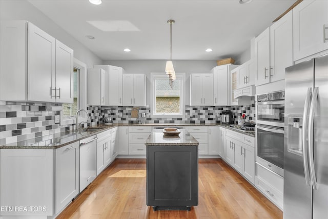 325 Pineberry Dr, Vonore, TN 37885 - kitchen with appliances with stainless steel finishes, a sink, plenty of natural light, stone countertops, and recessed lighting