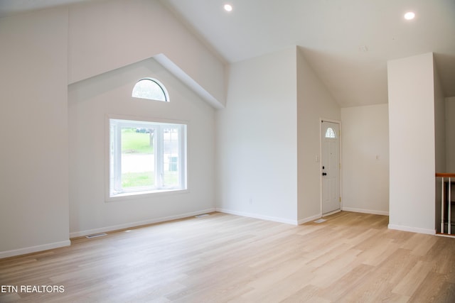 422 Willow Tree Ln, Morristown, TN 37814 - unfurnished living room with vaulted ceiling, light wood-type flooring, and recessed lighting
