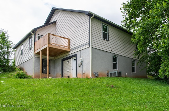 422 Willow Tree Ln, Morristown, TN 37814 - rear view of house with a lawn and stucco siding