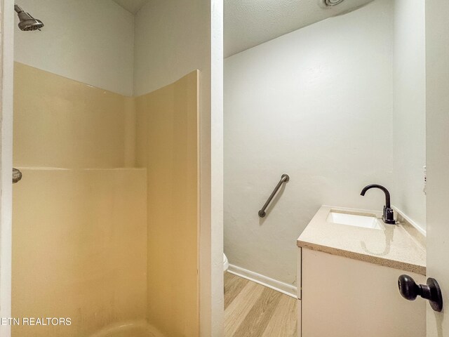 422 Willow Tree Ln, Morristown, TN 37814 - bathroom featuring wood finished floors, a shower, and vanity