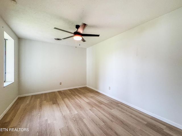 422 Willow Tree Ln, Morristown, TN 37814 - empty room with light wood-style flooring and ceiling fan