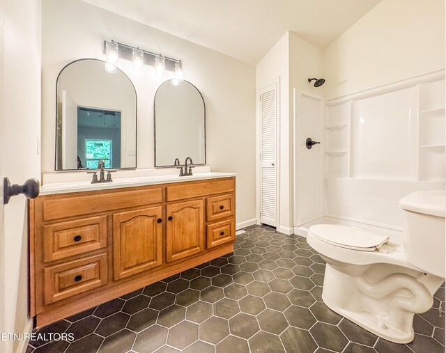 422 Willow Tree Ln, Morristown, TN 37814 - bathroom with vanity, a closet, a shower, and tile patterned floors