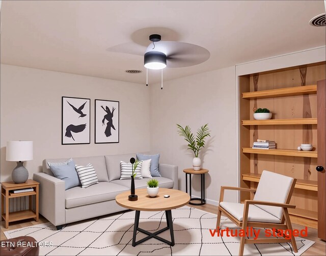 422 Willow Tree Ln, Morristown, TN 37814 - living room with a ceiling fan, built in shelves, and light wood-style floors