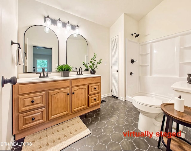 422 Willow Tree Ln, Morristown, TN 37814 - bathroom with a shower, double vanity, tile patterned floors, and a closet