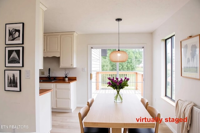 422 Willow Tree Ln, Morristown, TN 37814 - dining space with light wood-style floors and baseboards