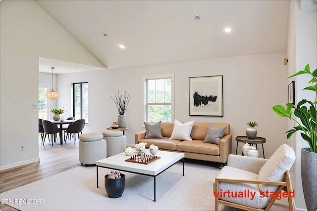 422 Willow Tree Ln, Morristown, TN 37814 - living room with light wood finished floors, lofted ceiling, and recessed lighting