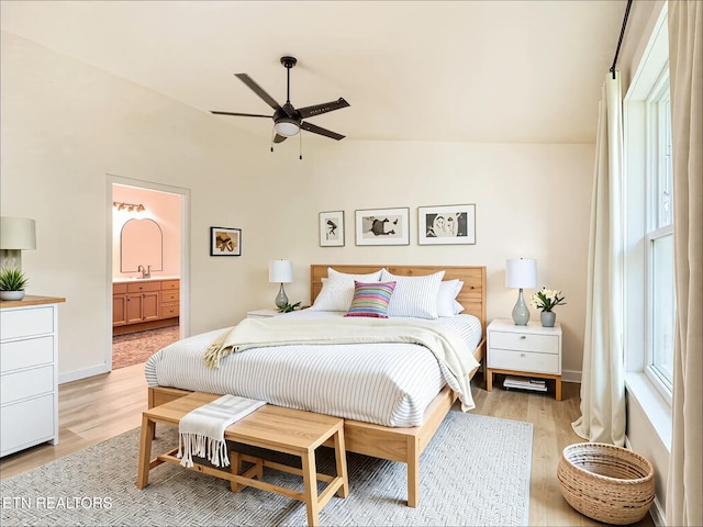 422 Willow Tree Ln, Morristown, TN 37814 - bedroom featuring vaulted ceiling, light wood-type flooring, and ensuite bathroom
