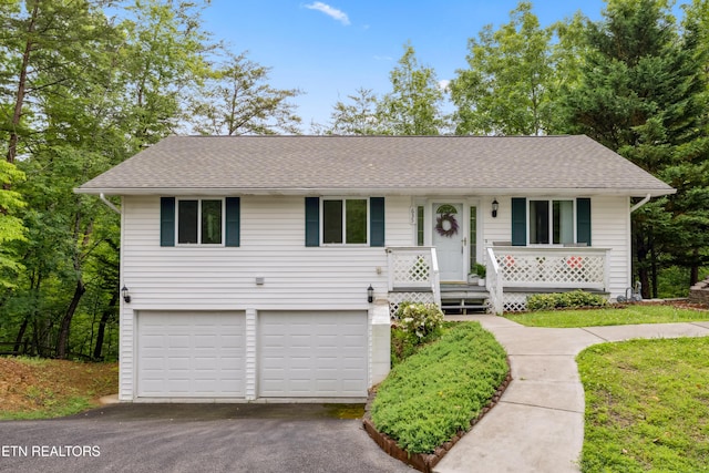 635 Gold Dust Dr, Pigeon Forge, TN 37863 - single story home with asphalt driveway, a garage, and a shingled roof