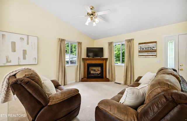635 Gold Dust Dr, Pigeon Forge, TN 37863 - carpeted living area with healthy amount of natural light, a ceiling fan, lofted ceiling, baseboards, and a fireplace with raised hearth