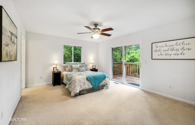 635 Gold Dust Dr, Pigeon Forge, TN 37863 - bedroom featuring access to outside, multiple windows, baseboards, and light carpet
