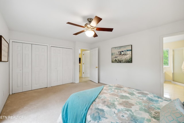 635 Gold Dust Dr, Pigeon Forge, TN 37863 - bedroom featuring multiple closets, light colored carpet, baseboards, and ceiling fan